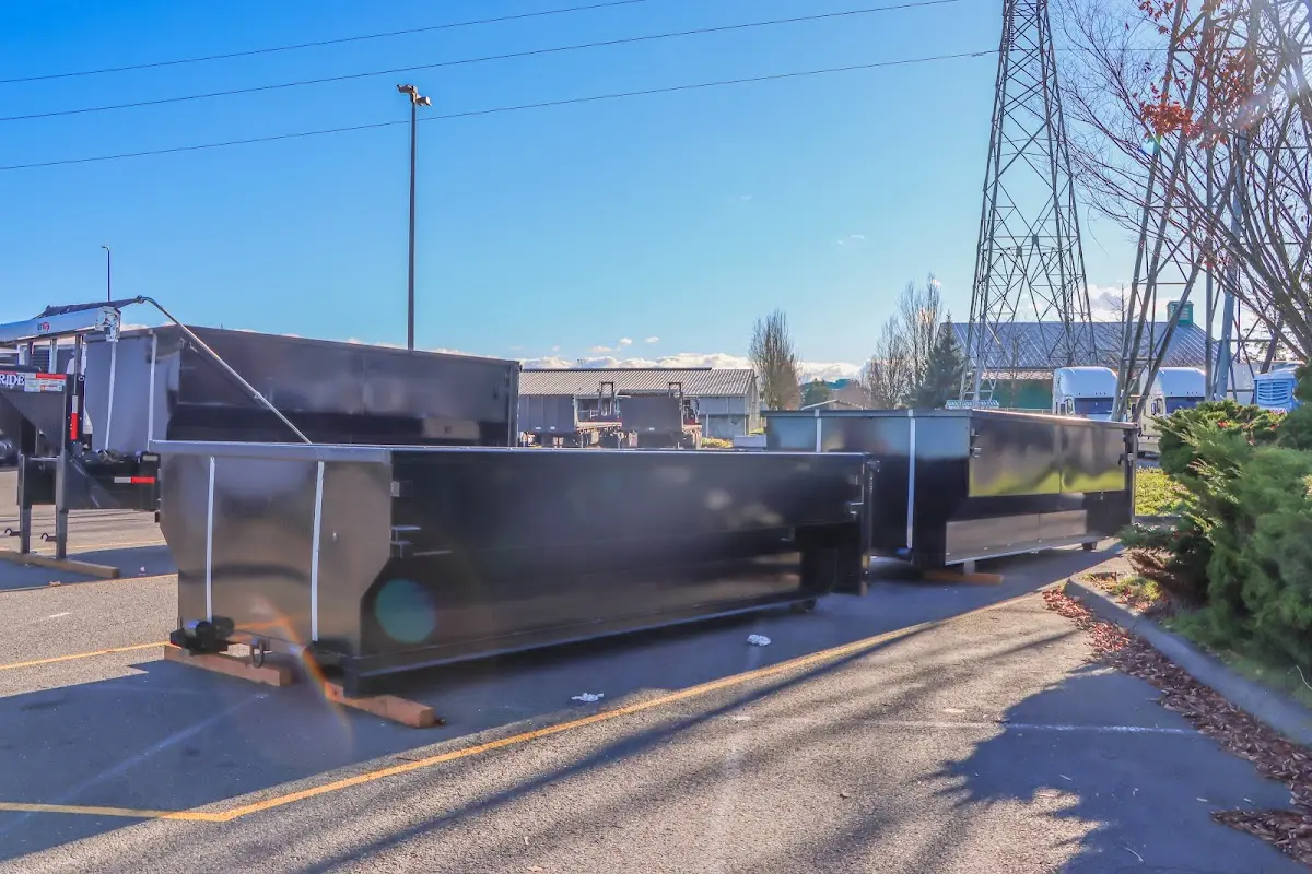 Roll-off dumpster ready for waste disposal at job site for Concrete Dumpster Rental in Englewood